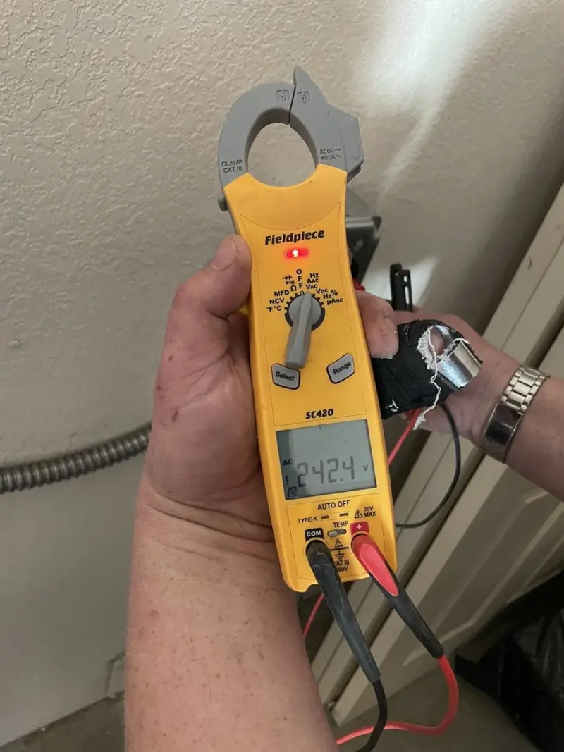 Voltage testing with clamp meter during Electrical Installation Services in Crestwood